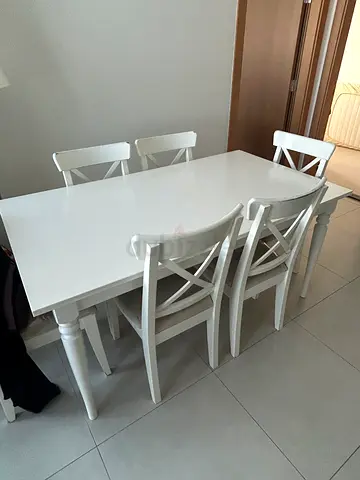 **For Sale: IKEA Dining Table with 6 Chairs** Used for 5 years and in good condition.