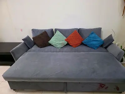 Grey convertible sofa bed with cushions - good condition