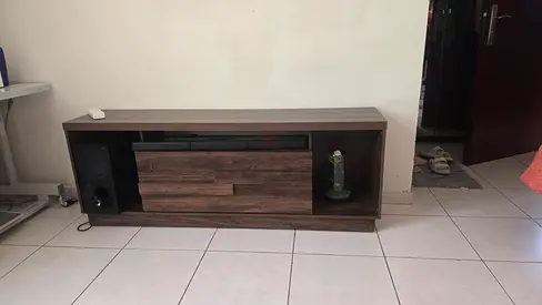 Low-profile wooden TV entertainment unit with storage - dark wood finish