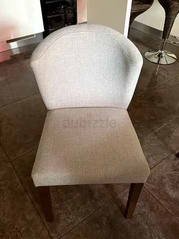 Light grey upholstered dining/side chair with wooden legs