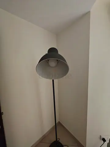 Ikea black floor standing lamp with metal shade and bulb