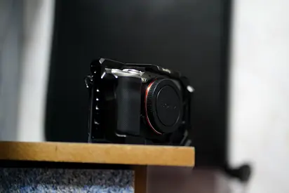 Sony mirrorless camera body (no lens) in protective cage