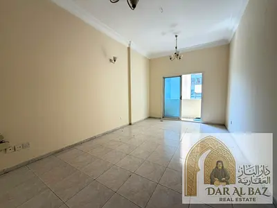 A one-bedroom apartment with a living room is available for annual rent in the Al Qasimia/Al Mahatt