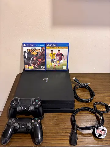PS4 pro 1tb with 2 controllers and 2 games