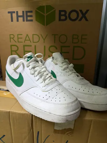 White Nike Air Force style sneakers with green swoosh, US12/EU46/UK11