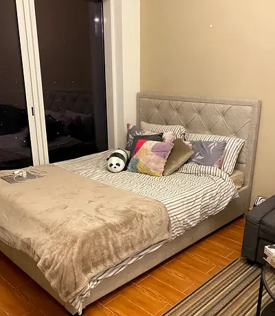 Queen size upholstered bed frame with tufted headboard
