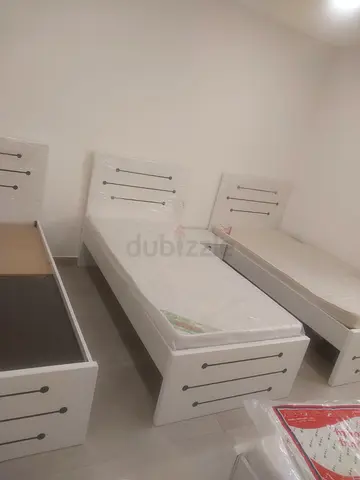 Three white single beds with headboards and mattresses - good condition