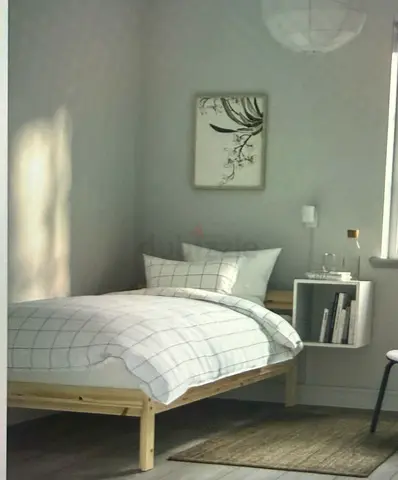 Single wooden bed frame with mattress - simple pine design