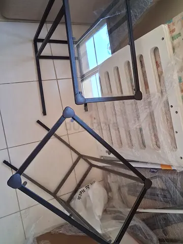 Set of 2 glass-top side Ikea VITTSJÖ tables with black metal frames