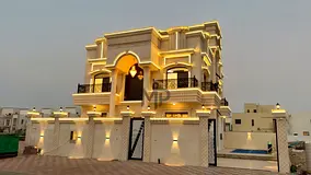 Villa with a swimming pool for sale in Ajman. Features 5 master bedrooms, a majlis, and 2 halls. The