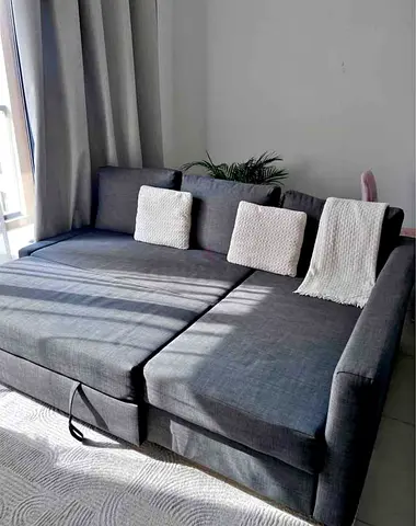 Grey L-shaped Sofa Bed with Storage - Good Condition