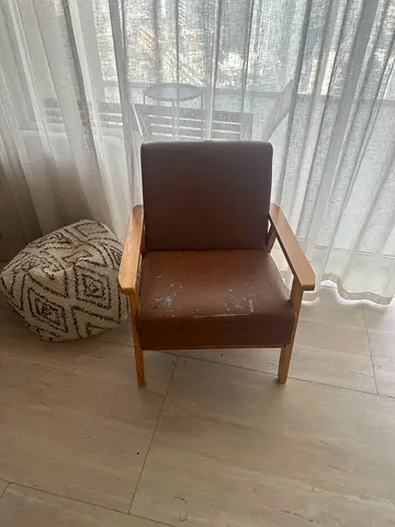 Wooden frame armchair with brown upholstery - used