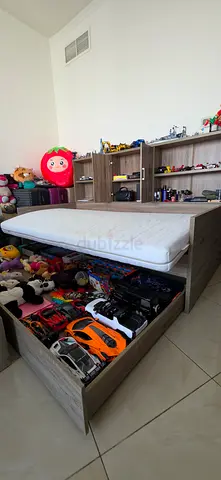 For Sale: 2-in-1 Pull-Out Bed with Storage Shelves
Modern and practical wooden bed in good conditio