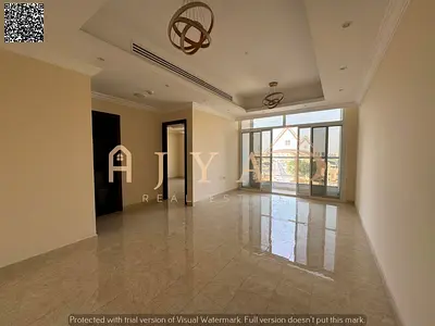 2BR apartment in a new building for annual rent in Al Rawda 2, Ajman. Private parking, 2 baths, balcony, central AC, easy payments, prime location nea