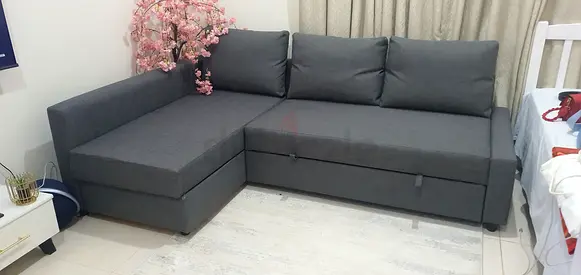 Dark grey L-shaped sectional sofa with storage, good condition