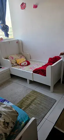 White baby/toddler bed with storage drawers - good condition