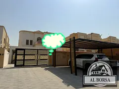 Villa for rent in Ajman, Al Rawda 3, located on an asphalt road. It features 5 master bedrooms, an e