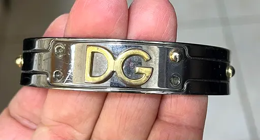 DG logo metal bracelet — two-tone stainless cuff