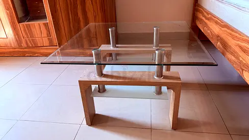 Modern glass-top coffee table with wooden base