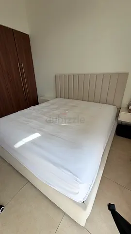 Queen upholstered bed with headboard and mattress - good condition