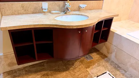 Wall-mounted bathroom vanity unit with marble top and sink