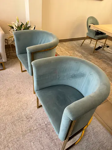 Pair of turquoise velvet chairs with gold metal frame. 250 each