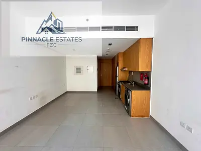 Studio with kitchen appliances and parking
