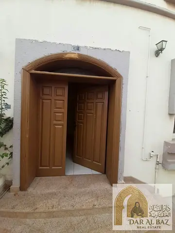 Villa for annual rent in a Sharjah villa complex; a two-story unit featuring three bedrooms, a living area, a kitchen, a maid's room, a laundry room,