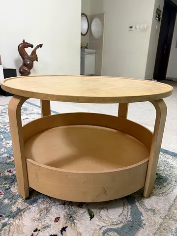 IKEA Round light wood coffee table with lower shelf