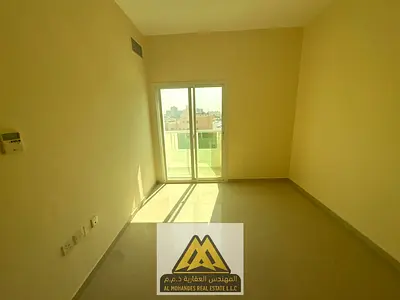 1BR in Al Hamidiya 1, central AC and balcony, AED 28,005 yearly, payable in 4 or 6 payments.