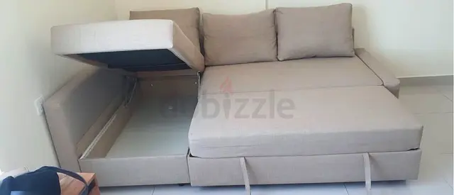Light grey L-shape storage sofa bed — good condition