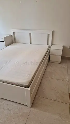 White wooden single bed frame with headboard and storage drawer and mattress