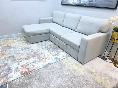Light grey L-shaped 3-seater sofa with chaise and storage