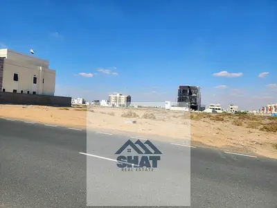 ارض زاوية  تجارية سكنية تصريح ارضي + 3 طابق على شارع رئيسي حيوي اسفلت 50 مترعرض خورفكان منطقة الحراي التجارية