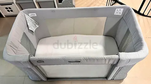 Used Chicco Next2Me Forever crib with wheels in light grey