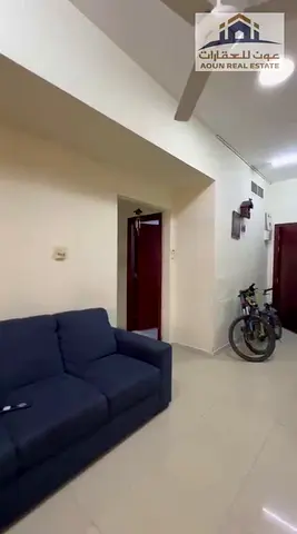 للبيع شقة غرفتين وصالتين في برج الريف 1 | مع موقف سيارة | مؤجرة بـ40 ألف درهم | 420,000 درهم