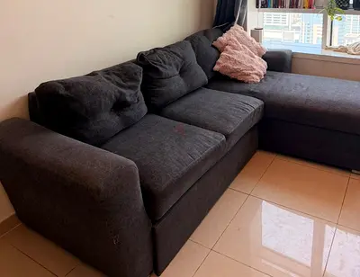 Dark grey L-shaped 3-seater sofa with chaise
