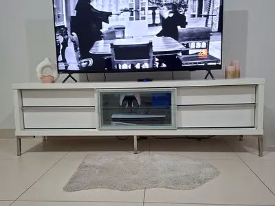 White modern TV cabinet with glass center and storage drawers - good condition