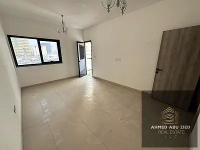 A brand new two-bedroom apartment in a modern building, featuring an elegant design and excellent space, located in a prime, strategic location in the
