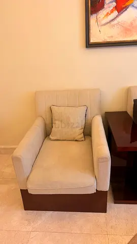Beige Upholstered Armchair with Wooden Base