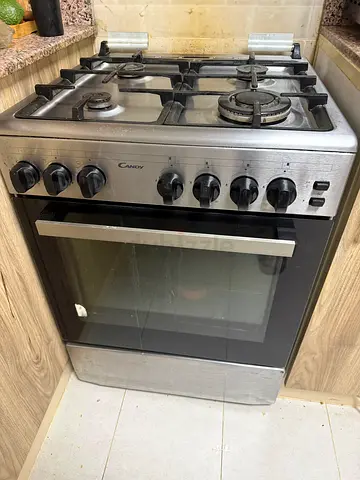 Candy freestanding gas cooker with oven - 4 burners, stainless steel