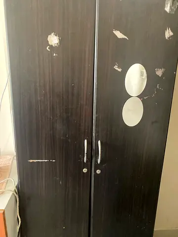 Used dark wood wardrobe / armoire with two doors, some surface wear