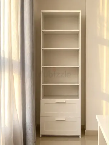 Tall white shelving unit with drawers - good condition