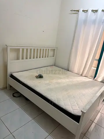 White wooden double bed frame with mattress - good condition