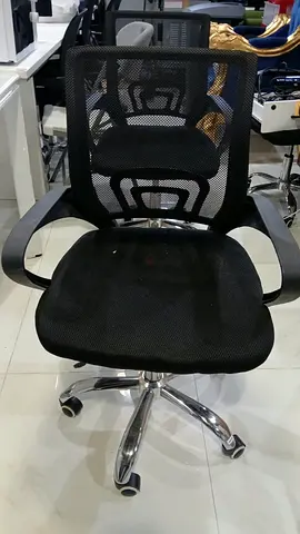 Black mesh ergonomic office chair with adjustable height
