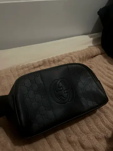Black Gucci embossed leather sling bag / pouch - good condition
