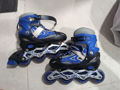 Adjustable Blue Inline Skates - Kids Size 34-38, Good Condition