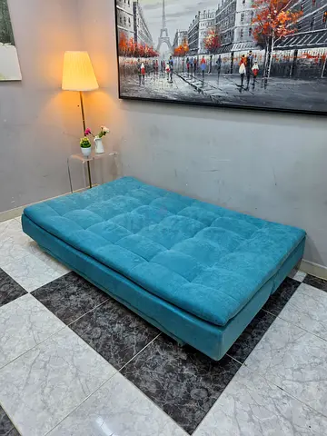 Blue foldable sofa bed / futon - good condition