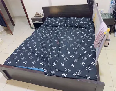 Used Bed with mattress, dark wood dresser with mirror and shelving and a refrigerator for sale