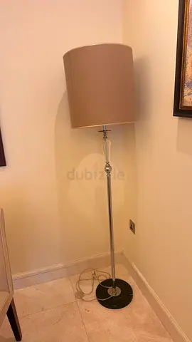 Slim chrome floor lamp with beige drum shade